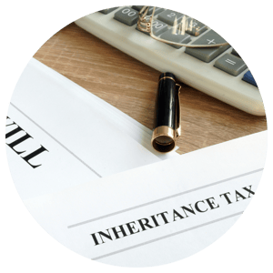 inheritance tax paper with will on table with calculator and pen 
