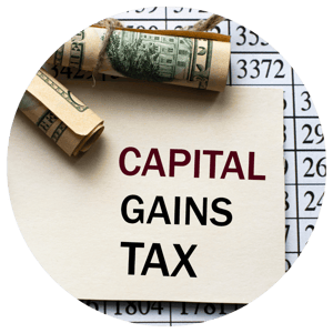 capital gains tax text with dollar bills 