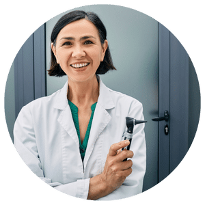 physician standing in front of door while wearing lab coat 