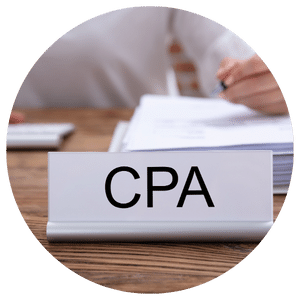 cpa nameplate on desk with papers